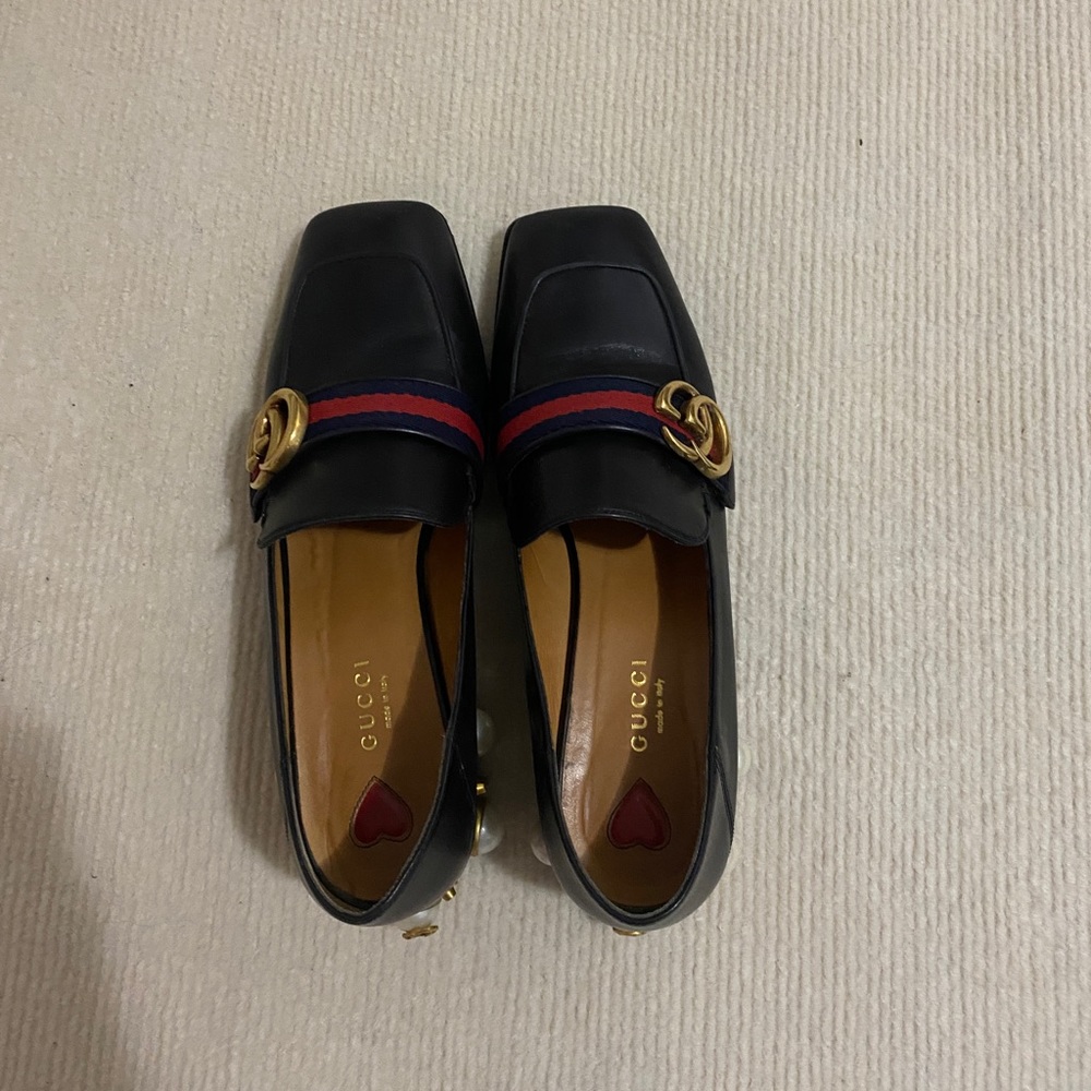 Gucci loafers with pearl details on heels
